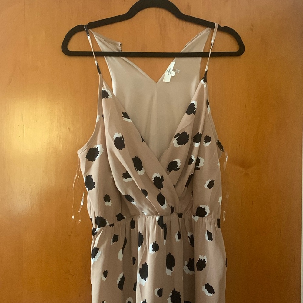 Jumpsuit, tan with black & white detail. Spaghetti strap, button back. Size L